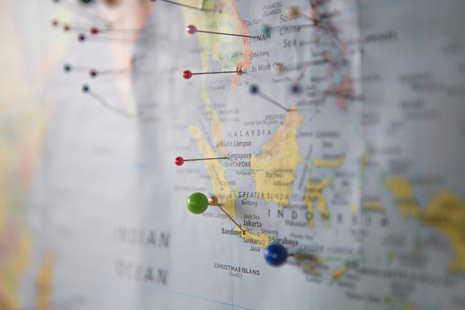 A map of Southeast Asia marked with colorful pins at different cities.